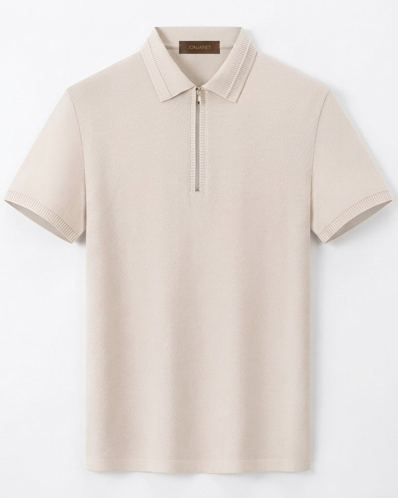 Beige polo shirt with a quarter zip on a light gray background