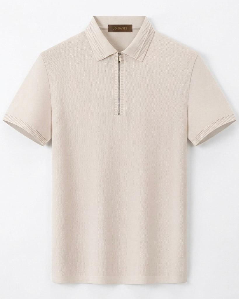 Beige polo shirt with a brand label on a light gray background