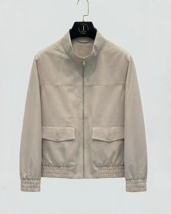 Beige jacket on a hanger against a white background