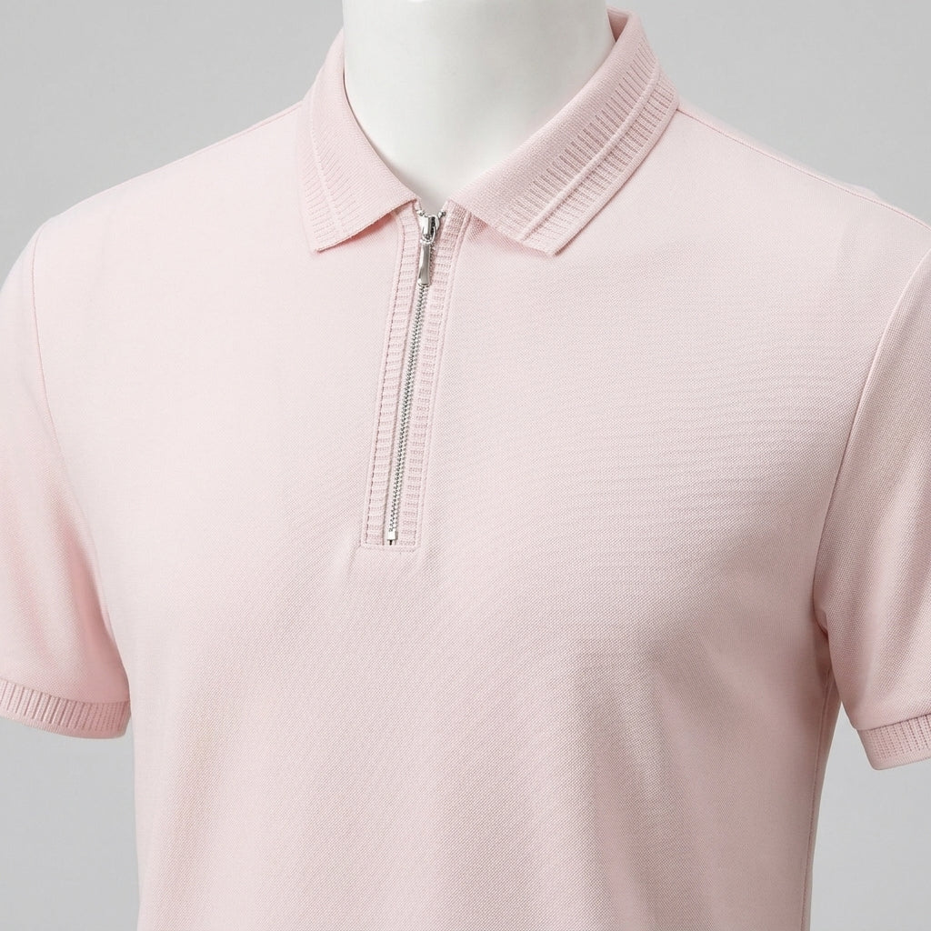 Pink polo shirt with a zipper on a gray background