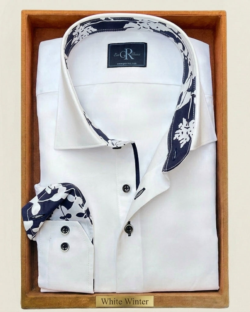 White dress shirt with floral cuffs and collar in a wooden box on a beige background