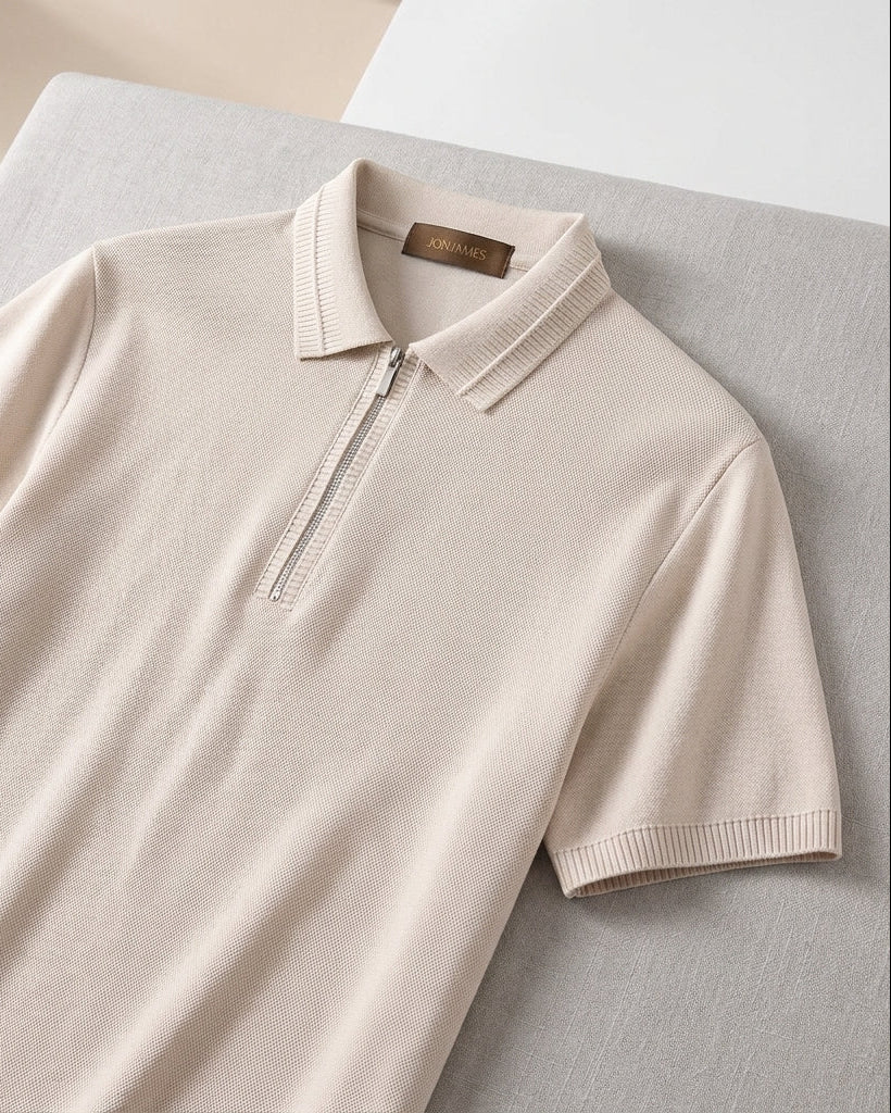 Beige short-sleeve polo shirt on a light gray surface