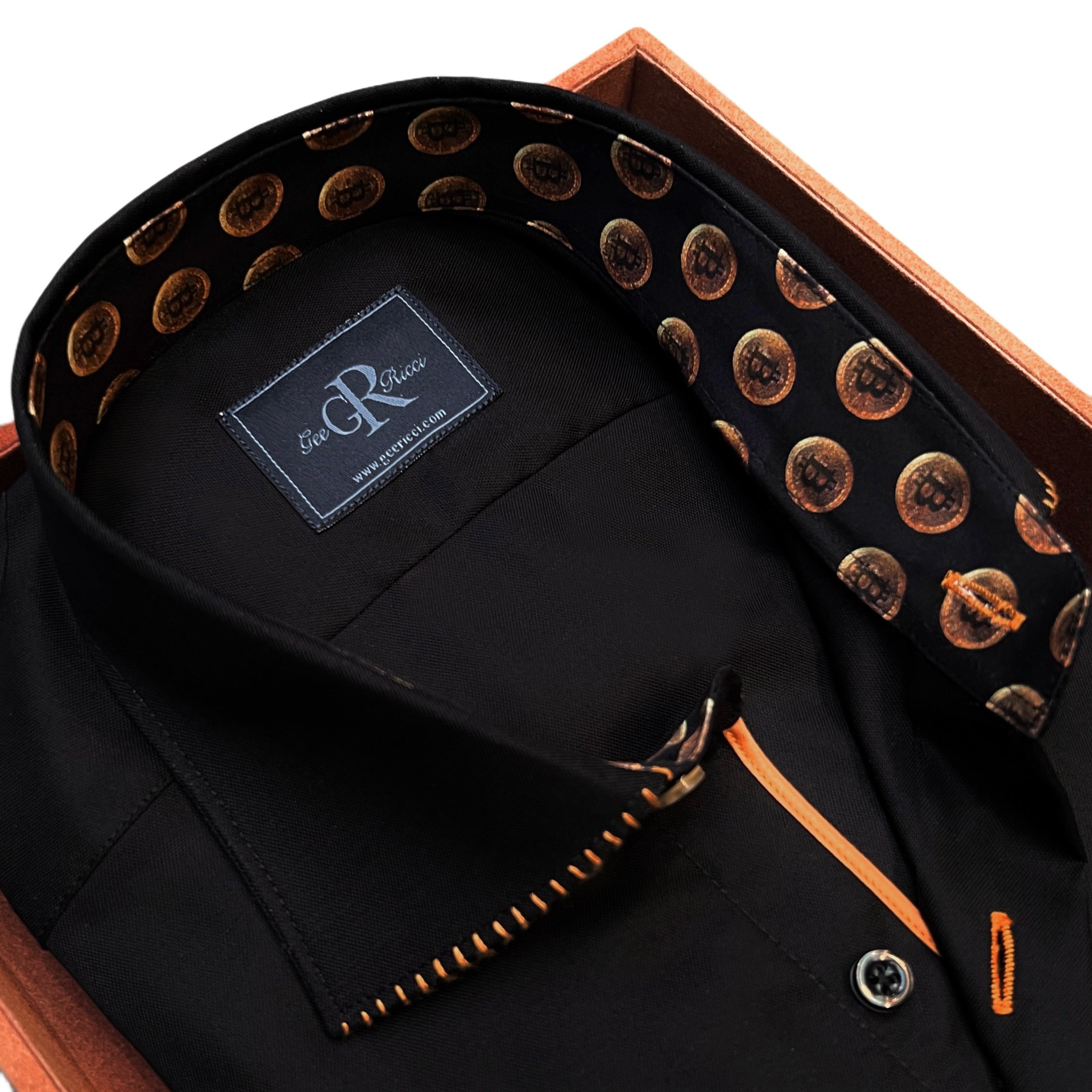 A black shirt with gold collar stitching and gold trim along the button placket, displayed on a wooden hanger with the brand label 'G&G' visible on the collar.