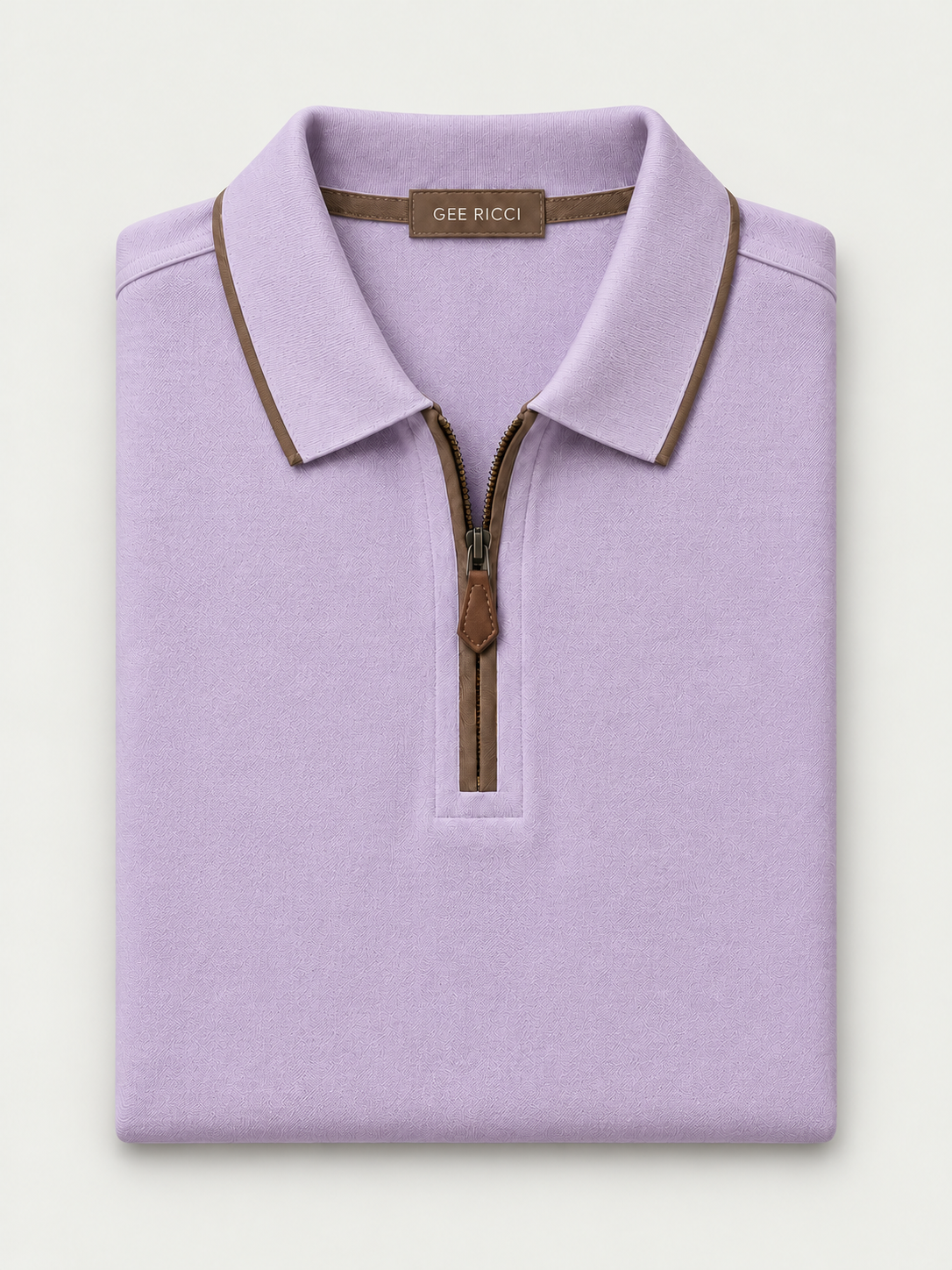 Lila Riviera Performance Polo folded on pale grey background