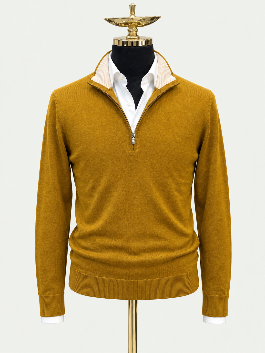 Mustard Mirage on gold mannequin against pale grey background