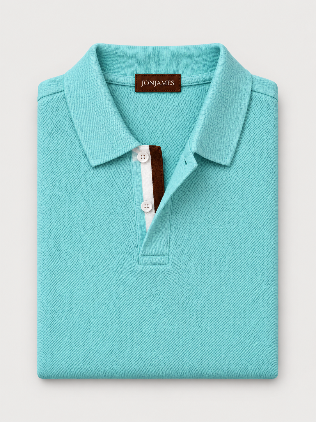 Aqua Piqué Polo - Long Sleeve - Regular Fit folded on pale grey background