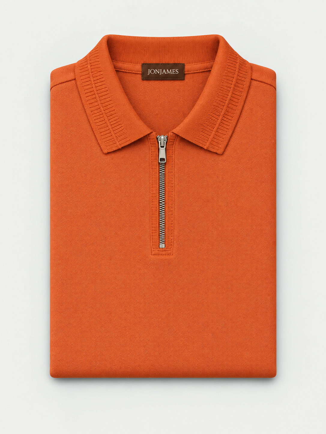 Terracotta Knit Polo - Regular Fit folded on pale grey background