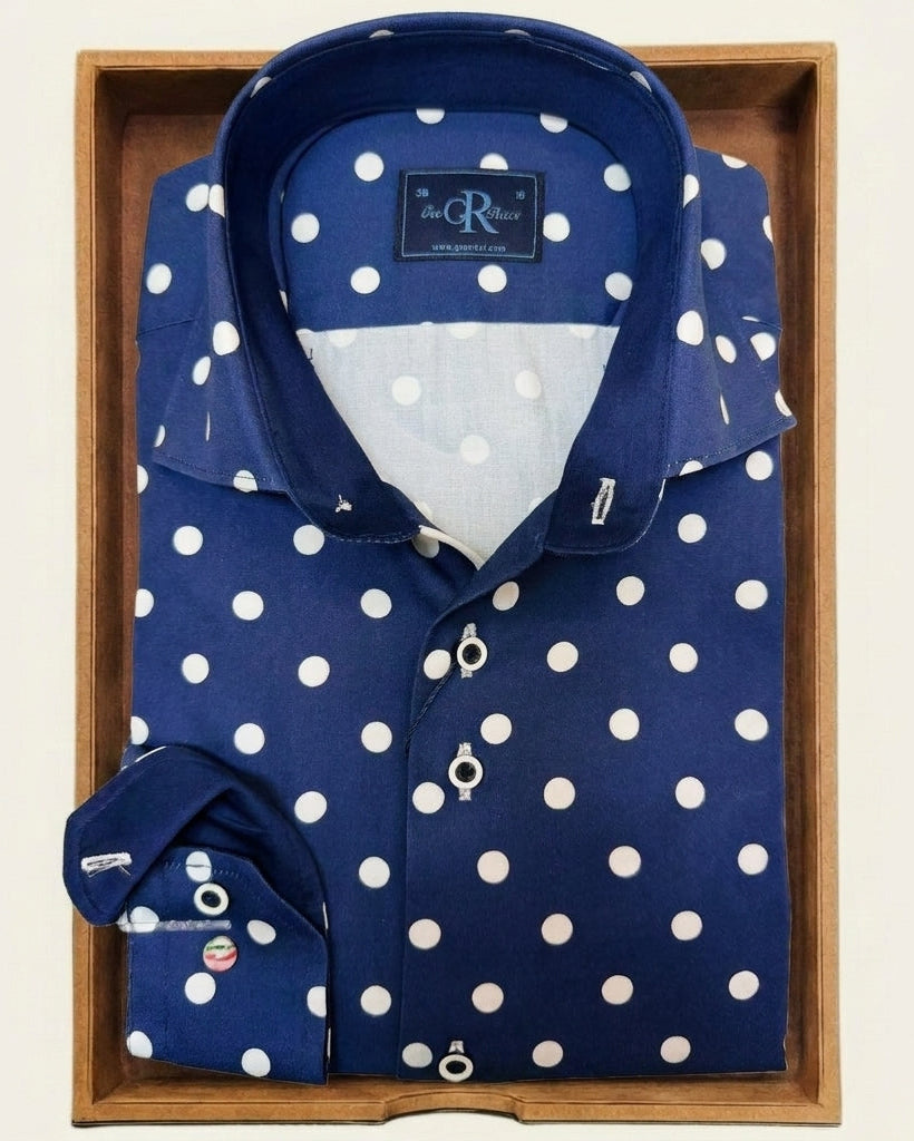 Blue shirt with white polka dots in a wooden box