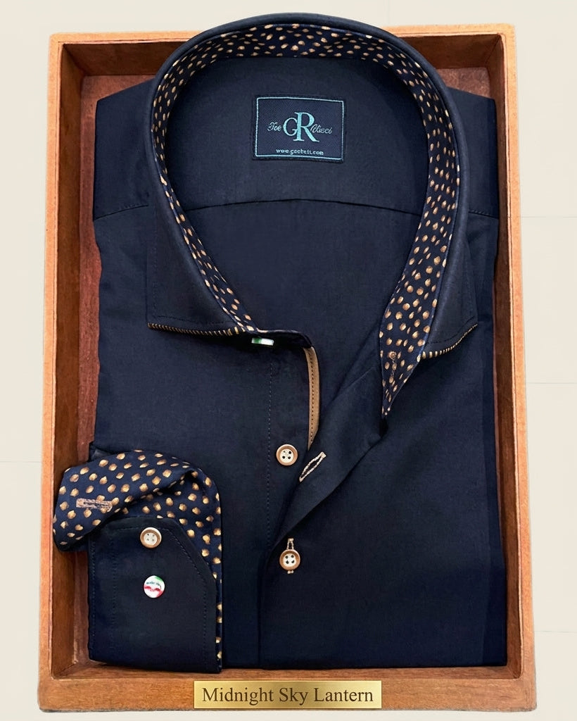 Navy shirt with patterned collar and cuffs in a wooden box, featuring a visible brand logo.