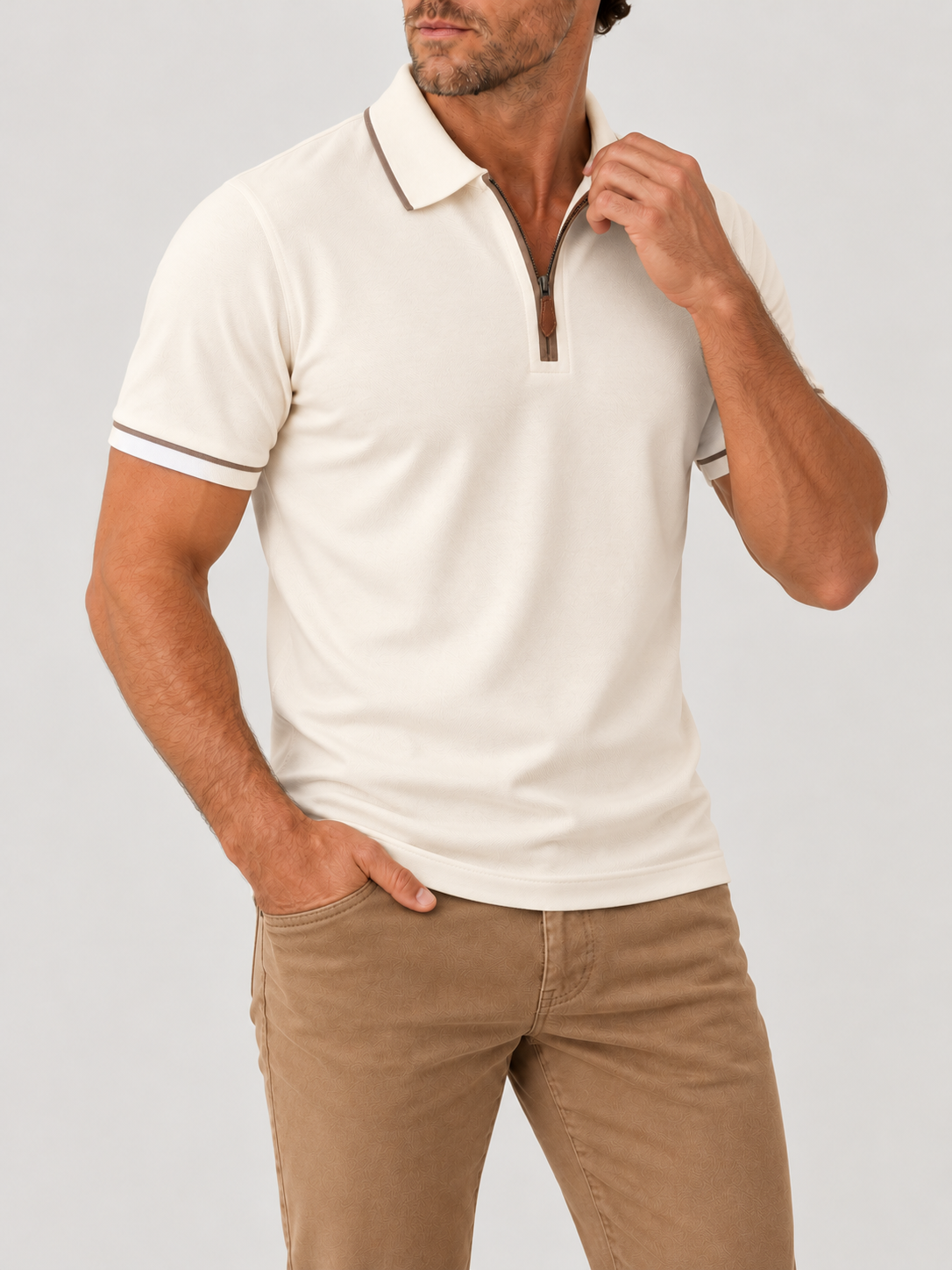 Cream Riviera Performance Polo on model against pale grey background