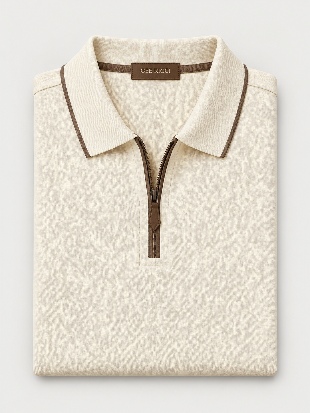 Cream Riviera Performance Polo folded on pale grey background