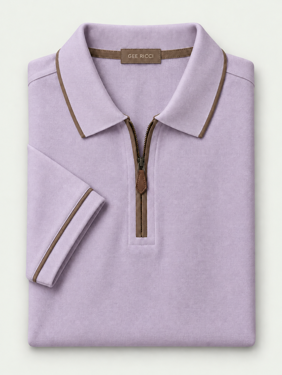 Lila Riviera Performance Polo – folded polo on pale grey background