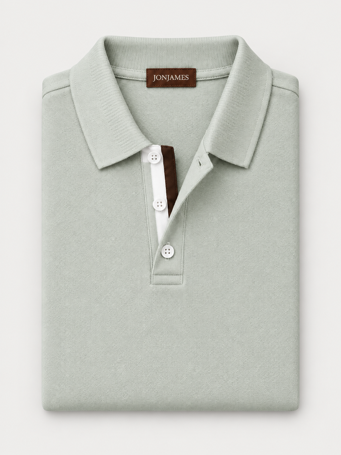 Sage Piqué Polo - Long Sleeve - Regular Fit folded on pale grey background