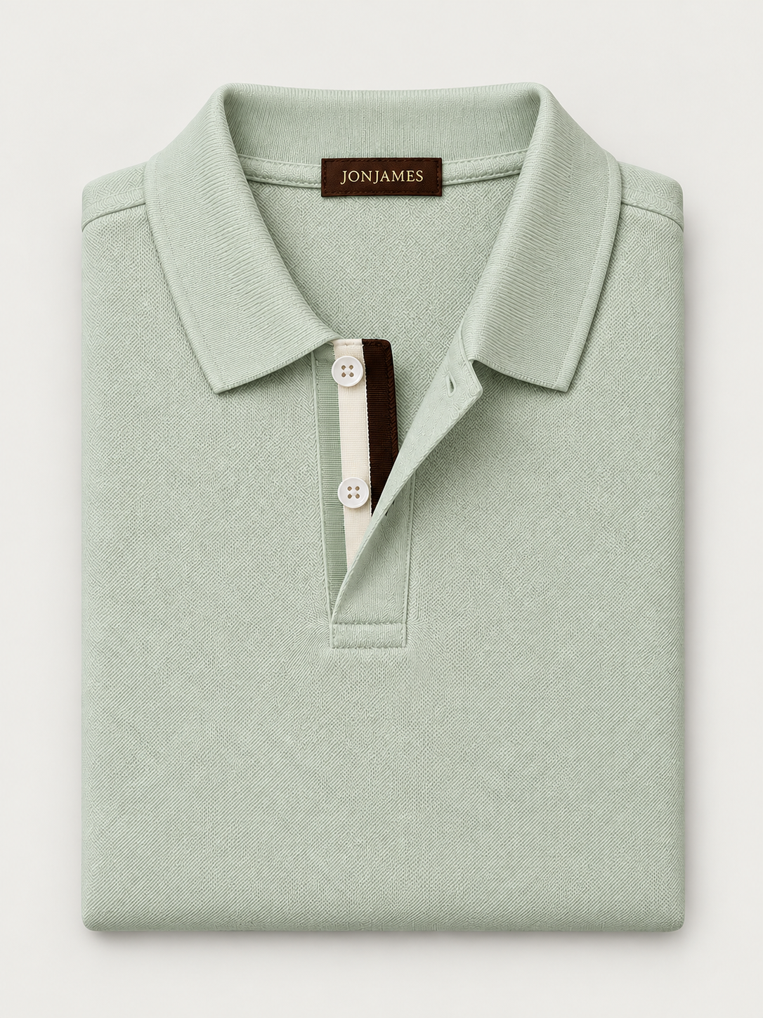 Sage Piqué Polo - Short Sleeve - Regular Fit folded on pale grey background