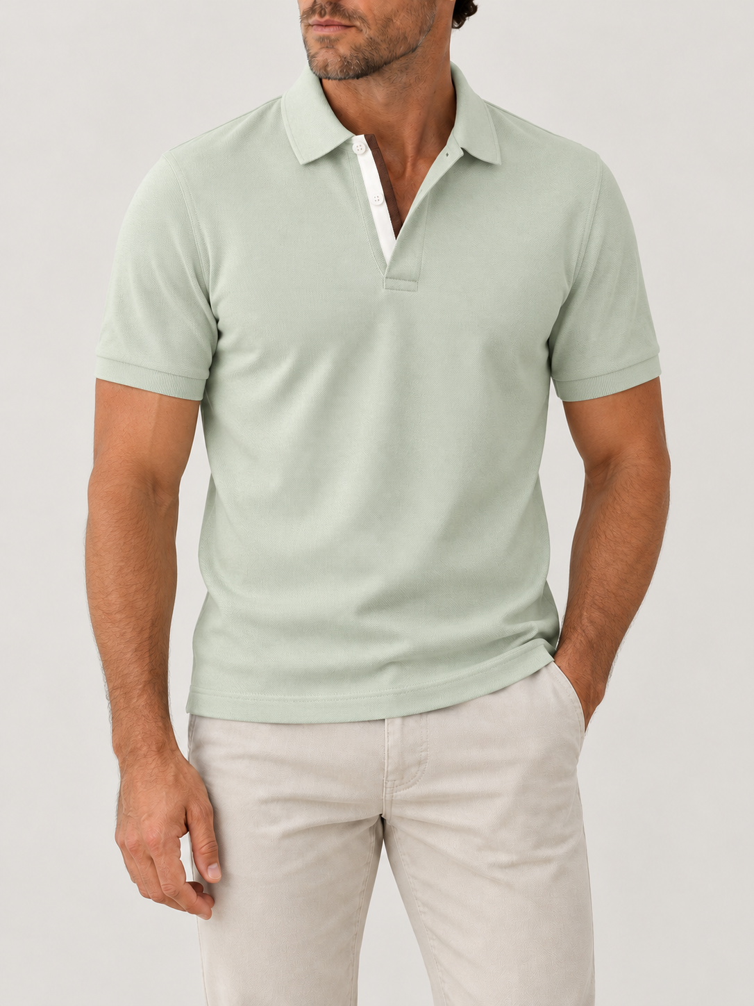 Sage Piqué Polo - Short Sleeve - Regular Fit on model against pale grey background