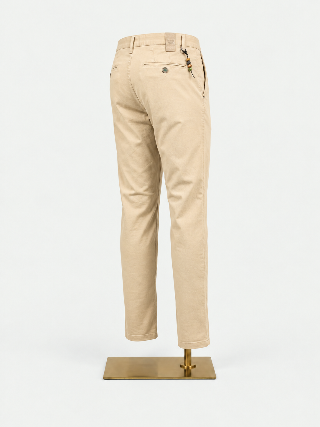 Birdseye Sand Chinos on gold mannequin stand
