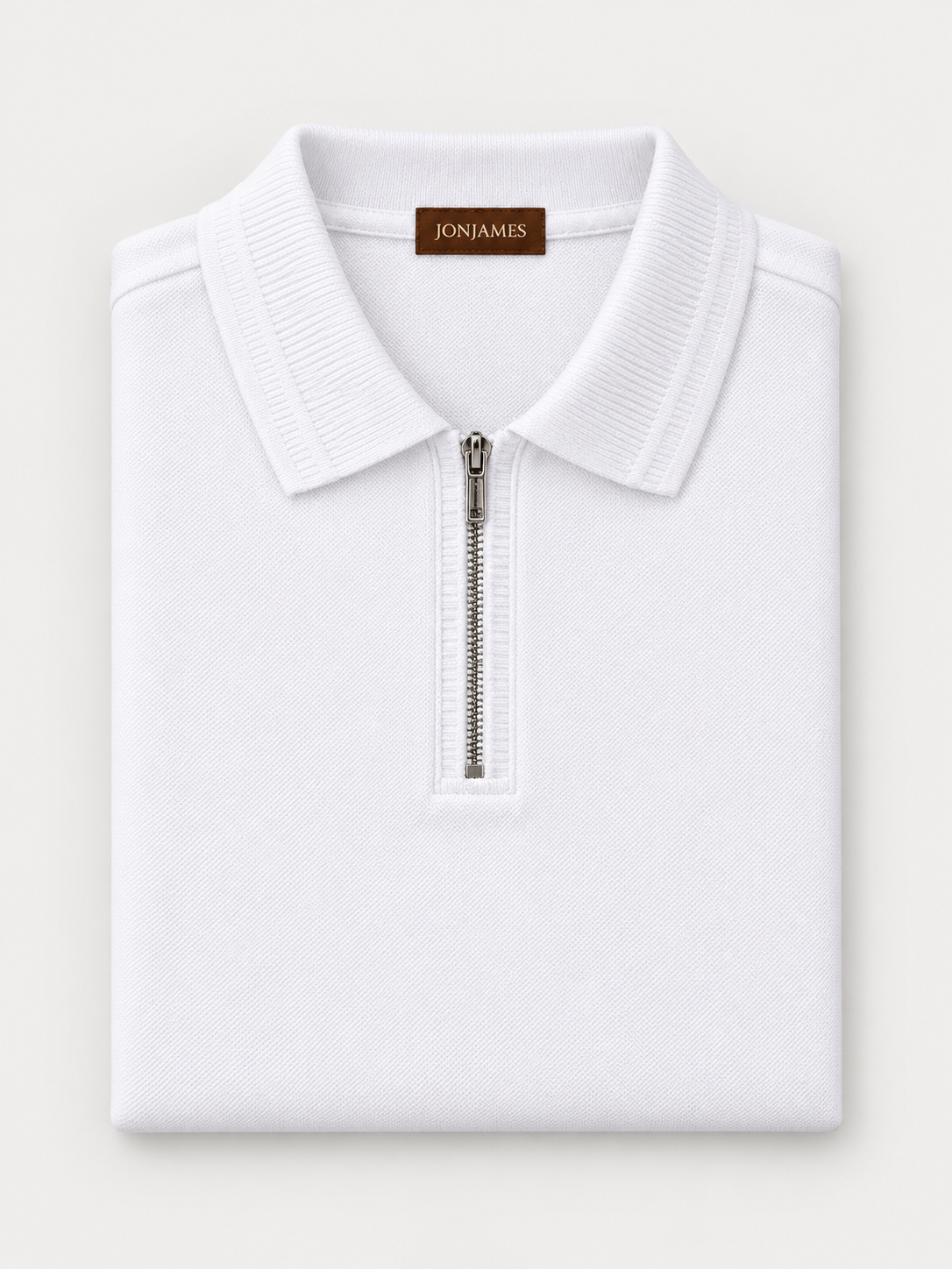 White Knit Polo - Regular Fit folded on pale grey background